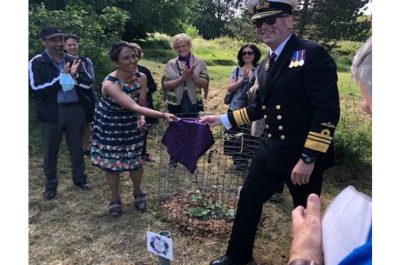 Vice Admiral Allan Richards DL installs a Plaque at the NHS Fig Tree